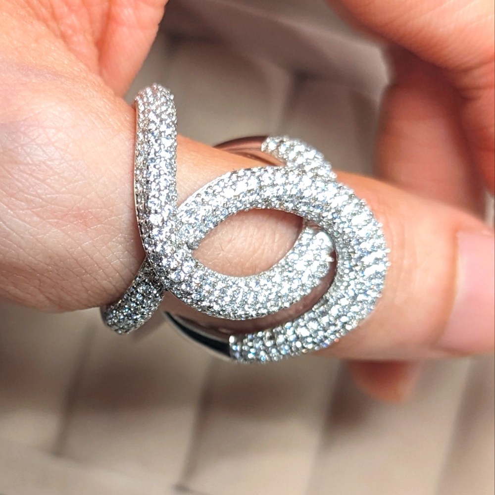 Sterling silver with rhodium plating, pave set cubic zirconia cocktail ring.